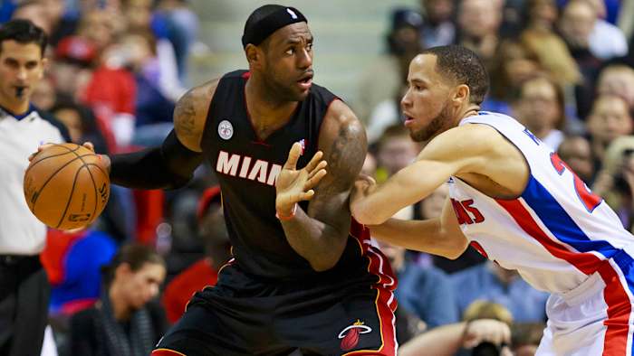 Miami Heat small forward LeBron James is defended by Detroit Pistons small forward Tayshaun Prince.